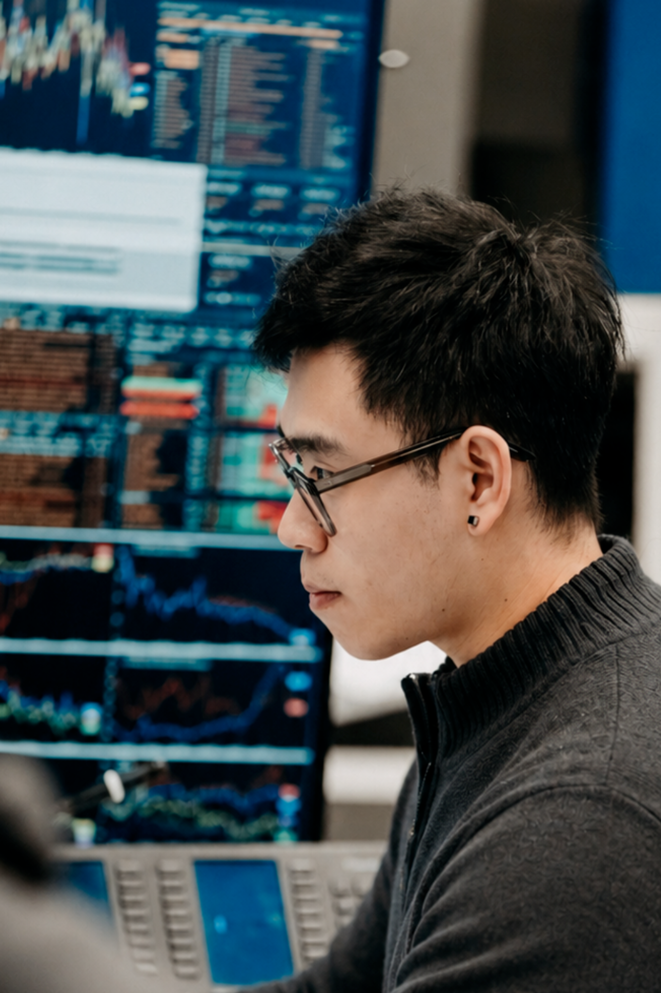 Investment professional working at market monitors